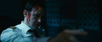 Movie still from “7500” (2019), directed by Patrick Vollrath – A man with blood all over his face; Close Up shot, High angle