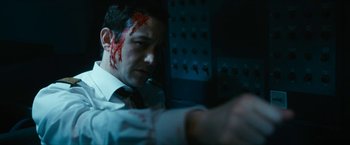 Movie still from “7500” (2019), directed by Patrick Vollrath – A man with blood all over his face; Close Up shot, High angle