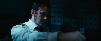 Movie still from “7500” (2019), directed by Patrick Vollrath – A man with blood all over his face; Close Up shot, High angle