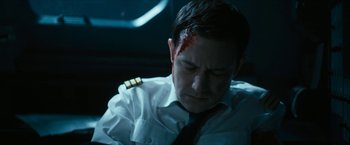 Movie still from “7500” (2019), directed by Patrick Vollrath – A man in a white shirt with blood on his face; Close Up shot, High angle