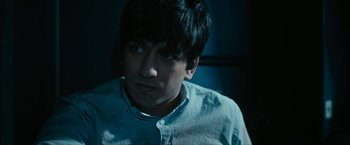 Movie still from “7500” (2019), directed by Patrick Vollrath – A young man stares into the distance with a serious look; Close Up shot, High angle