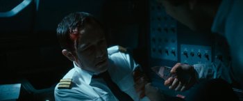 Movie still from “7500” (2019), directed by Patrick Vollrath – A man in a uniform is holding a knife; Close Up shot, High angle