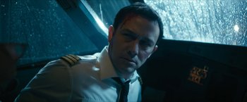 Movie still from “7500” (2019), directed by Patrick Vollrath – A person wearing a uniform; Close Up shot, High angle