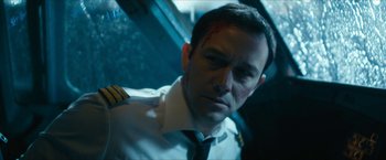 Movie still from “7500” (2019), directed by Patrick Vollrath – A person wearing a uniform; Close Up shot, High angle