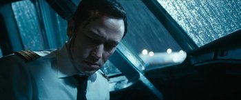 Movie still from “7500” (2019), directed by Patrick Vollrath – A person wearing a suit and tie; Close Up shot, Low angle