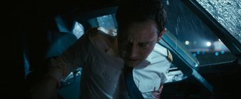 Movie still from “7500” (2019), directed by Patrick Vollrath – A man in a white shirt and a blue neck tie; Medium shot, High angle