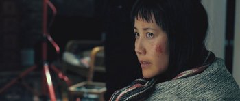 Movie still from “88 Minutes” (2007), directed by Jon Avnet – A person wearing a sweater; Close Up shot, Low angle