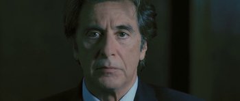 Movie still from “88 Minutes” (2007), directed by Jon Avnet – A person wearing a suit and tie; Close Up shot, Low angle