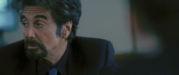 Movie still from “88 Minutes” (2007), directed by Jon Avnet – A person wearing a suit and tie; Close Up shot, Over the shoulder angle