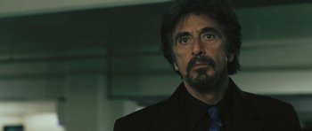 Movie still from “88 Minutes” (2007), directed by Jon Avnet – A person wearing a suit and tie; Close Up shot, Over the shoulder angle