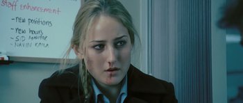 Movie still from “88 Minutes” (2007), directed by Jon Avnet – A young woman with a bruised face stares into the camera; Close Up shot, Over the shoulder angle
