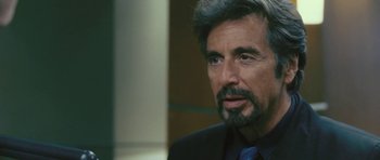 Movie still from “88 Minutes” (2007), directed by Jon Avnet – A person wearing a suit and tie; Close Up shot, Over the shoulder angle