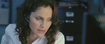 Movie still from “88 Minutes” (2007), directed by Jon Avnet – A person wearing a white shirt; Close Up shot, Over the shoulder angle