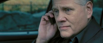Movie still from “88 Minutes” (2007), directed by Jon Avnet – An older man is talking on a cell phone; Close Up shot, Low angle