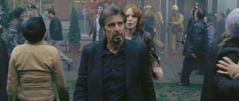 Movie still from “88 Minutes” (2007), directed by Jon Avnet – A man and a woman walking down a sidewalk; Medium shot, Over the shoulder angle