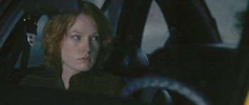Movie still from “88 Minutes” (2007), directed by Jon Avnet – A woman sitting in the back seat of a car; Close Up shot, Over the shoulder angle