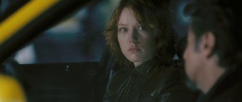 Movie still from “88 Minutes” (2007), directed by Jon Avnet – A woman sitting in the back seat of a car; Close Up shot, Over the shoulder angle