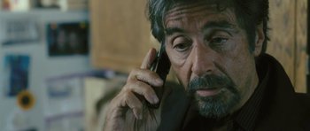 Movie still from “88 Minutes” (2007), directed by Jon Avnet – A person talking on a cell phone; Close Up shot, Over the shoulder angle