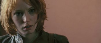 Movie still from “88 Minutes” (2007), directed by Jon Avnet – A person's face in front of a pink wall; Close Up shot, Low angle