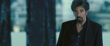 Movie still from “88 Minutes” (2007), directed by Jon Avnet – A man in a black jacket and a black shirt; Close Up shot, Over the shoulder angle