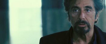 Movie still from “88 Minutes” (2007), directed by Jon Avnet – A person wearing a suit and tie; Close Up shot, Over the shoulder angle