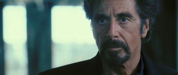 Movie still from “88 Minutes” (2007), directed by Jon Avnet – A person wearing a suit and tie; Close Up shot, Over the shoulder angle