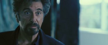 Movie still from “88 Minutes” (2007), directed by Jon Avnet – A person wearing a suit and tie; Close Up shot, Over the shoulder angle