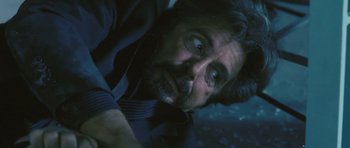 Movie still from “88 Minutes” (2007), directed by Jon Avnet – A man's face as he stares at the camera; Close Up shot, Overhead angle