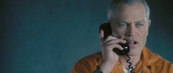 Movie still from “88 Minutes” (2007), directed by Jon Avnet – A person talking on a cell phone; Close Up shot, Low angle