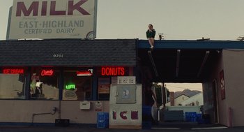 Movie still from “Euphoria” (2019), created by Sam Levinson – A woman standing on a roof of a building; Extreme Wide shot, Low angle