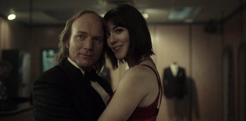 Movie still from “Fargo” (2014), created by Noah Hawley – A man and a woman posing for a picture; Close Up shot, Low angle