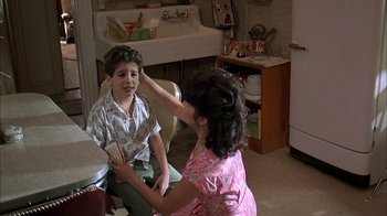 Movie still from “A Bronx Tale” (1993), directed by Robert De Niro – A young boy and a young girl in a room; Medium shot, Over the shoulder angle