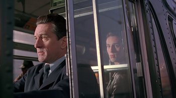 Movie still from “A Bronx Tale” (1993), directed by Robert De Niro – A man and a woman sitting in a bus; Close Up shot, Low angle