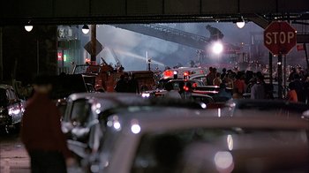 Movie still from “A Bronx Tale” (1993), directed by Robert De Niro – A group of people standing next to each other in a building; Extreme Wide shot, High angle