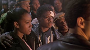Movie still from “A Bronx Tale” (1993), directed by Robert De Niro – A group of young men standing next to each other; Close Up shot, High angle