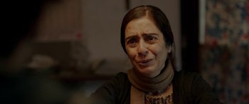 Movie still from “A Death in the Gunj” (2016), directed by Konkona Sen Sharma – A person wearing a scarf; Close Up shot, Over the shoulder angle