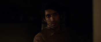 Movie still from “A Death in the Gunj” (2016), directed by Konkona Sen Sharma – A man with a beard is looking at the camera; Close Up shot, Over the shoulder angle