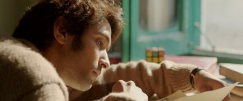 Movie still from “A Death in the Gunj” (2016), directed by Konkona Sen Sharma – A young man with a rubiks cube in his hand; Close Up shot, Low angle