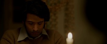 Movie still from “A Death in the Gunj” (2016), directed by Konkona Sen Sharma – A man sitting in front of a lit candle; Close Up shot, High angle