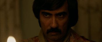 Movie still from “A Death in the Gunj” (2016), directed by Konkona Sen Sharma – A person with a beard and mustache; Close Up shot, High angle