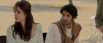 Movie still from “A Death in the Gunj” (2016), directed by Konkona Sen Sharma – A man and a woman sitting next to each other; Close Up shot, Over the shoulder angle