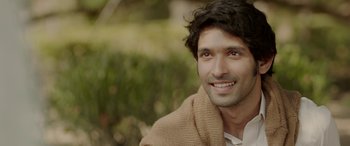 Movie still from “A Death in the Gunj” (2016), directed by Konkona Sen Sharma – A person wearing a sweater; Close Up shot, High angle
