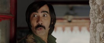 Movie still from “A Death in the Gunj” (2016), directed by Konkona Sen Sharma – A person with a beard and mustache; Close Up shot, Over the shoulder angle