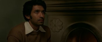 Movie still from “A Death in the Gunj” (2016), directed by Konkona Sen Sharma – A person wearing a sweater; Close Up shot, Over the shoulder angle