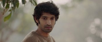 Movie still from “A Death in the Gunj” (2016), directed by Konkona Sen Sharma – A person wearing a sweater; Close Up shot, Low angle