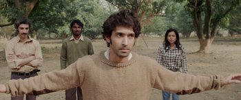 Movie still from “A Death in the Gunj” (2016), directed by Konkona Sen Sharma – A man standing next to two other men; Medium shot, Over the shoulder angle