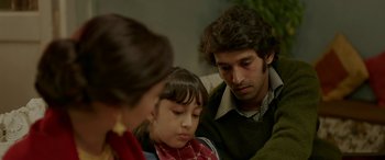 Movie still from “A Death in the Gunj” (2016), directed by Konkona Sen Sharma – A man and a woman and a little girl; Close Up shot, High angle