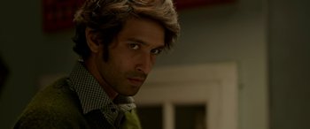 Movie still from “A Death in the Gunj” (2016), directed by Konkona Sen Sharma – A person wearing a shirt and tie; Close Up shot, Over the shoulder angle