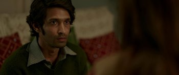Movie still from “A Death in the Gunj” (2016), directed by Konkona Sen Sharma – A person looking at a mirror; Close Up shot, Over the shoulder angle