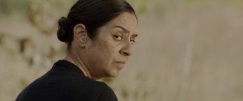 Movie still from “A Death in the Gunj” (2016), directed by Konkona Sen Sharma – A person looking at the camera; Close Up shot, Over the shoulder angle